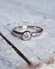 Load image into Gallery viewer, Close up of a bespoke Cornish made ATLANTIC engagement ring featuring a GIA certified 0.36ct ocean sourced diamond, that captures the essence of the ocean.