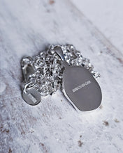 Load image into Gallery viewer, Back view of a bespoke sea glass and ocean diamond necklace showing the full UK hallmark on the back of the bezel and belcher chain. Handmade to last a lifetime.