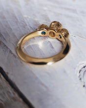 Load image into Gallery viewer, Back view of a yellow gold ROCK engagement ring. The textured bezels contrast harmoniously against the knife edge band.