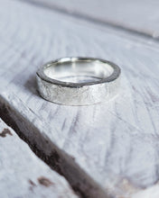 Load image into Gallery viewer, A heavy style silver mens ring which has been designed for a wedding day. It has a texture created by a hammer.