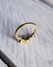 Load image into Gallery viewer, Back view of an 18ct yellow gold CAVERN engagement ring that shows South Jewellery's authentic storm finish. The texture is created by hammering the band with a piece of Cornish reef which leaves a rustic, weathered rock like finish.