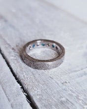 Load image into Gallery viewer, Back view of a handcrafted diamond and Cornish sea glass eternity ring. It shows our signature storm texture on the 18ct gold band.