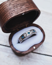 Load image into Gallery viewer, Side view showing turquoise and teal sea glass that is glistening along side white diamonds in this eternity ring which is made in 18ct white gold with a rustic finish.