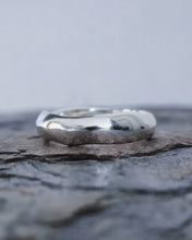 Load image into Gallery viewer, A close up of a bespoke freeform style wedding band for men which is 6mm wide and 2mm thick so designed to last a lifetime.
