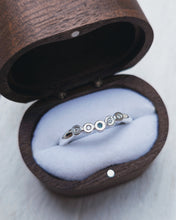 Load image into Gallery viewer, Curved wedding ring that is designed to interlock with an engagement ring. It features bezel set sea glass and diamonds.
