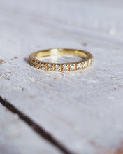 Load image into Gallery viewer, Close up of CELESTIAL eternity ring that features luxurious diamonds that were found in the ocean.
