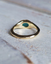 Load image into Gallery viewer, Back view of a bespoke TREASURE engagement signet ring, showcasing its handcrafted beautiful sea glass and freeform style band that is inspired by the Cornish coast and ocean.
