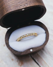 Load image into Gallery viewer, An 18ct yellow gold eternity ring that has a continuous row of paved set ocean sourced diamonds.

