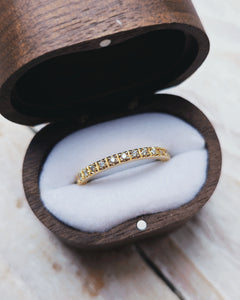 An 18ct yellow gold eternity ring that has a continuous row of paved set ocean sourced diamonds.