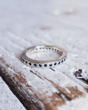 Load image into Gallery viewer, Infinity ocean inspired full eternity ring with flush set sapphires or diamonds and handcrafted in Cornwall.
